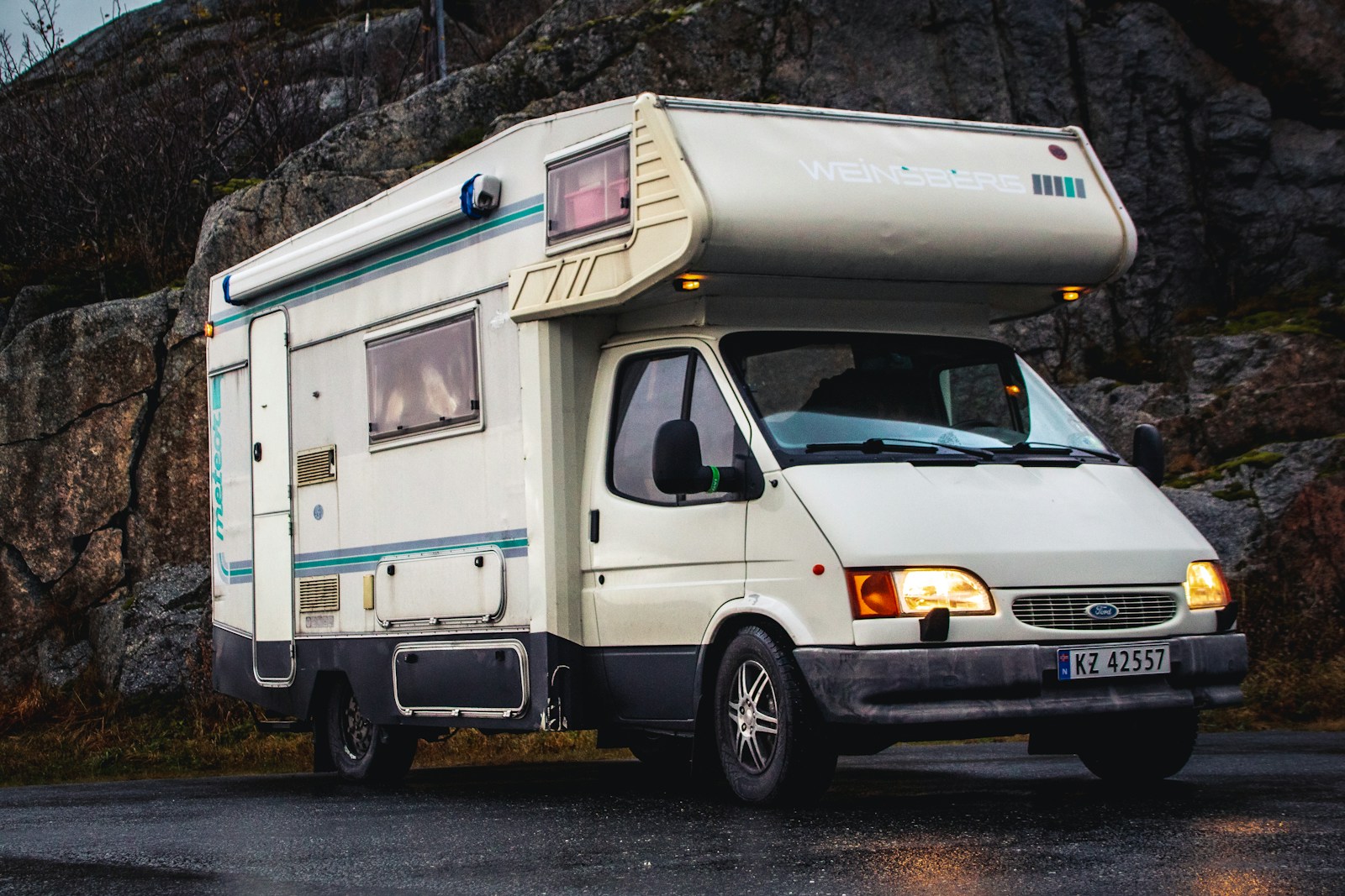 a white van with a large metal tank on top recreational vehicle